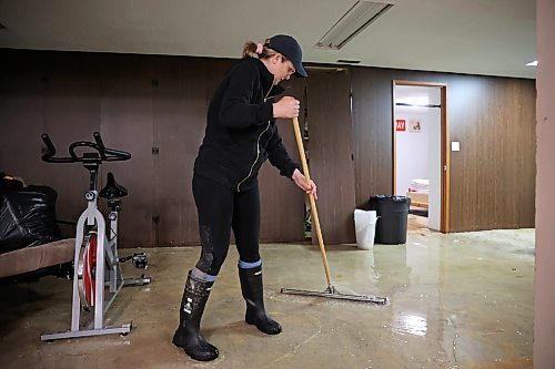 02072026
Angela Shtykalo squeegees water towards drains in the flooded basement of her family’s home on Wellington Crescent in Dauphin on Thursday, after heavy rains caused sewer backup and ground seepage flooding in several homes along the Vermillion river earlier in the week. 
(Tim Smith/The Brandon Sun)