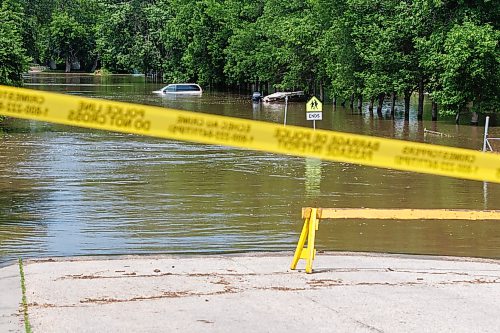 MIKE DEAL / FREE PRESS
Seventh Avenue North in Swan River, MB is completely flooded.
Manitoba Premier Wab Kinew flew to Dauphin, MB and Swan River, MB on Thursday to get a first hand look at some of the flood damage and to meet with officials and victims who are still in the midst of dealing with the situation.
260702 - Thursday, July 02, 2026.
