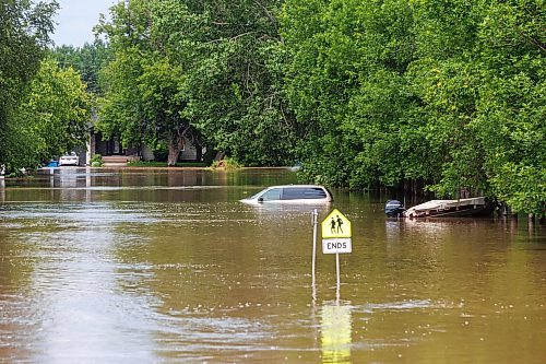 MIKE DEAL / FREE PRESS
Seventh Avenue North in Swan River, MB is completely flooded.
Manitoba Premier Wab Kinew flew to Dauphin, MB and Swan River, MB on Thursday to get a first hand look at some of the flood damage and to meet with officials and victims who are still in the midst of dealing with the situation.
260702 - Thursday, July 02, 2026.