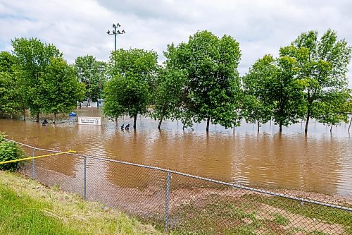 MIKE DEAL / FREE PRESS
A completely flooded Jack Brown memorial field in Swan River, MB.
Manitoba Premier Wab Kinew flew to Dauphin, MB and Swan River, MB on Thursday to get a first hand look at some of the flood damage and to meet with officials and victims who are still in the midst of dealing with the situation.
260702 - Thursday, July 02, 2026.
