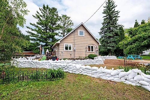MIKE DEAL / FREE PRESS
A house is surrounded by sandbags in Swan River, MB.
Manitoba Premier Wab Kinew flew to Dauphin, MB and Swan River, MB on Thursday to get a first hand look at some of the flood damage and to meet with officials and victims who are still in the midst of dealing with the situation.
260702 - Thursday, July 02, 2026.