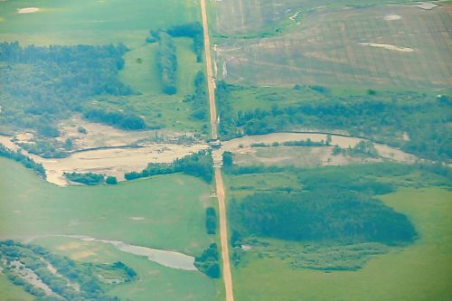 MIKE DEAL / FREE PRESS
A road is washed away from high water between Dauphin, MB, and Swan River, MB.
Manitoba Premier Wab Kinew flew to Dauphin, MB and Swan River, MB on Thursday to get a first hand look at some of the flood damage and to meet with officials and victims who are still in the midst of dealing with the situation.
260702 - Thursday, July 02, 2026.