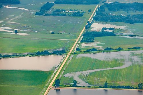 MIKE DEAL / FREE PRESS
Water covers farmland between Dauphin, MB, and Swan River, MB.
Manitoba Premier Wab Kinew flew to Dauphin, MB and Swan River, MB on Thursday to get a first hand look at some of the flood damage and to meet with officials and victims who are still in the midst of dealing with the situation.
260702 - Thursday, July 02, 2026.