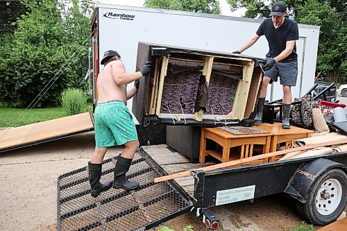 02072026
Hayden Shtykalo and his dad Devin remove a ruined couch from the flooded basement of their home on Wellington Crescent in Dauphin on Thursday, after heavy rains caused sewer backup and ground seepage flooding in several homes along the Vermillion river earlier in the week.
(Tim Smith/The Brandon Sun)