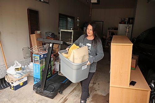 02072026
Marnie Shumanski unloads ruined carpet from the flooded basement of her relatives home on Macleod Avenue West in Dauphin on Thursday, after heavy rains caused sewer backup and ground seepage flooding in several homes along the Vermillion river earlier in the week.
(Tim Smith/The Brandon Sun)