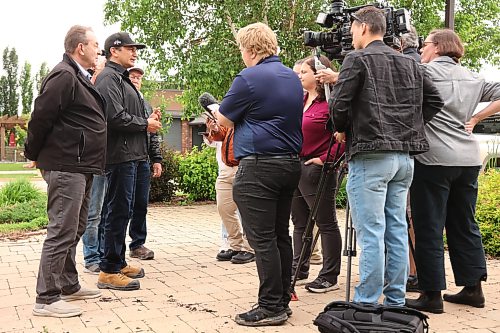 02072026
Manitoba Premier Wab Kinew speaks to journalists outside Dauphin City Hall while touring the flood damage in the city on Thursday. (Tim Smith/The Brandon Sun)