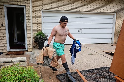 02072026
Hayden Shtykalo removes ruined carpet from the basement of his family’s flooded home along Wellington Crescent in Dauphin on Thursday, after heavy rains caused sewer backup and ground seepage flooding in several homes along the Vermillion river earlier in the week.
(Tim Smith/The Brandon Sun)