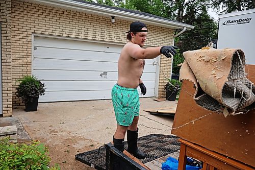 02072026
Hayden Shtykalo removes ruined carpet from the basement of his family’s flooded home along Wellington Crescent in Dauphin on Thursday, after heavy rains caused sewer backup and ground seepage flooding in several homes along the Vermillion river earlier in the week.
(Tim Smith/The Brandon Sun)
