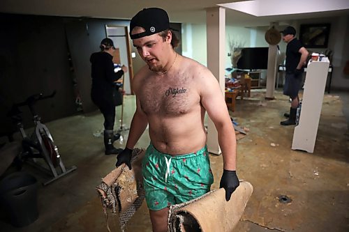 02072026
Hayden Shtykalo removes ruined carpet from the basement of his family’s flooded home along Wellington Crescent in Dauphin on Thursday, after heavy rains caused sewer backup and ground seepage flooding in several homes along the Vermillion river earlier in the week.
(Tim Smith/The Brandon Sun)