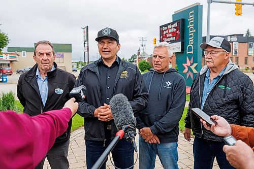MIKE DEAL / FREE PRESS
Manitoba Premier Wab Kinew holds a brief press conference after meeting with the Mayor of Dauphin, David Bosiak (second from right), RM of Dauphin Reeve Ernie Sirski (right), Dauphin MLA and Agriculture Minister Ron Kostyshyn (left) in Dauphin, MB. 
Manitoba Premier Wab Kinew flew to Dauphin, MB and Swan River, MB on Thursday to get a first hand look at some of the flood damage and to meet with officials and victims who are still in the midst of dealing with the situation.
260702 - Thursday, July 02, 2026.