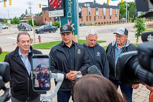 MIKE DEAL / FREE PRESS
Manitoba Premier Wab Kinew holds a brief press conference after meeting with the Mayor of Dauphin, David Bosiak (second from right), RM of Dauphin Reeve Ernie Sirski (right), Dauphin MLA and Agriculture Minister Ron Kostyshyn (left) in Dauphin, MB. 
Manitoba Premier Wab Kinew flew to Dauphin, MB and Swan River, MB on Thursday to get a first hand look at some of the flood damage and to meet with officials and victims who are still in the midst of dealing with the situation.
260702 - Thursday, July 02, 2026.