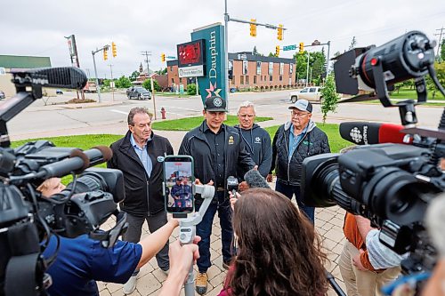 MIKE DEAL / FREE PRESS
Manitoba Premier Wab Kinew holds a brief press conference after meeting with the Mayor of Dauphin, David Bosiak (second from right), RM of Dauphin Reeve Ernie Sirski (right), Dauphin MLA and Agriculture Minister Ron Kostyshyn (left) in Dauphin, MB. 
Manitoba Premier Wab Kinew flew to Dauphin, MB and Swan River, MB on Thursday to get a first hand look at some of the flood damage and to meet with officials and victims who are still in the midst of dealing with the situation.
260702 - Thursday, July 02, 2026.
