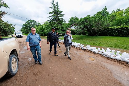 MIKE DEAL / FREE PRESS
Manitoba Premier Wab Kinew is given a tour of Swan River, MB, by Mayor Lance Jacobson (right) and Bill Gade Reeve (left) of the RM of Swan Valley West.
Manitoba Premier Wab Kinew flew to Dauphin, MB and Swan River, MB on Thursday to get a first hand look at some of the flood damage and to meet with officials and victims who are still in the midst of dealing with the situation.
260702 - Thursday, July 02, 2026.