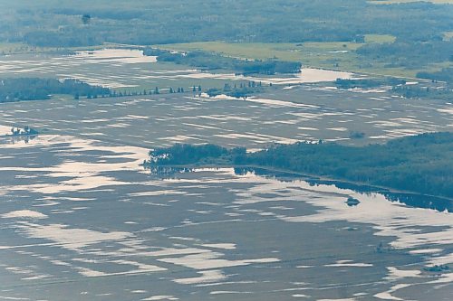 MIKE DEAL / FREE PRESS
Water covers farmland between Dauphin, MB, and Swan River, MB.
Manitoba Premier Wab Kinew flew to Dauphin, MB and Swan River, MB on Thursday to get a first hand look at some of the flood damage and to meet with officials and victims who are still in the midst of dealing with the situation.
260702 - Thursday, July 02, 2026.