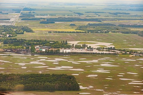 MIKE DEAL / FREE PRESS
Water covers farmland between Dauphin, MB, and Swan River, MB.
Manitoba Premier Wab Kinew flew to Dauphin, MB and Swan River, MB on Thursday to get a first hand look at some of the flood damage and to meet with officials and victims who are still in the midst of dealing with the situation.
260702 - Thursday, July 02, 2026.
