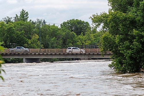 MIKE DEAL / FREE PRESS
Vehicles drive over a bridge in Swan River, MB.
Manitoba Premier Wab Kinew flew to Dauphin, MB and Swan River, MB on Thursday to get a first hand look at some of the flood damage and to meet with officials and victims who are still in the midst of dealing with the situation.
260702 - Thursday, July 02, 2026.