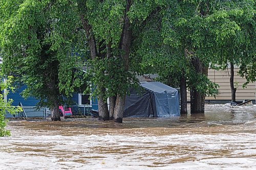 MIKE DEAL / FREE PRESS
The Swan River overflows its banks, flooding nearby homes in Swan River, MB.
Manitoba Premier Wab Kinew flew to Dauphin, MB and Swan River, MB on Thursday to get a first hand look at some of the flood damage and to meet with officials and victims who are still in the midst of dealing with the situation.
260702 - Thursday, July 02, 2026.