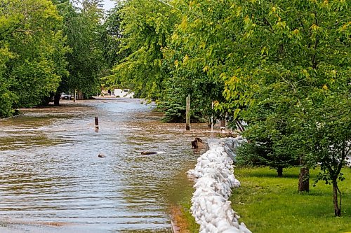 MIKE DEAL / FREE PRESS
Sixth Avenue North in Swan River, MB, is completely flooded.
Manitoba Premier Wab Kinew flew to Dauphin, MB and Swan River, MB on Thursday to get a first hand look at some of the flood damage and to meet with officials and victims who are still in the midst of dealing with the situation.
260702 - Thursday, July 02, 2026.