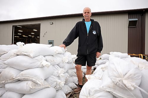 Minnedosa Mayor Ken Cameron stands among sandbags filled by volunteers on Friday. The Little Saskatchewan River is expected to continue to rise as water from recent rains in the area makes its way into the river and downstream. (Photos by Tim Smith/The Brandon Sun)
