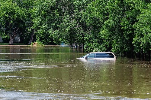 MIKE DEAL / FREE PRESS
Seventh Avenue North in Swan River, MB is completely flooded.
Manitoba Premier Wab Kinew flew to Dauphin, MB and Swan River, MB on Thursday to get a first hand look at some of the flood damage and to meet with officials and victims who are still in the midst of dealing with the situation.
260702 - Thursday, July 02, 2026.
