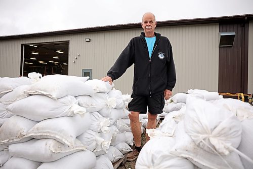 03062026
Minnedosa Mayor Ken Cameron amongst sandbags filled by volunteers on Friday as part of potential flood preparations. The Little Saskatchewan River is expected to continue to rise as water from all the recent rains in the area makes its way into the river and downstream.
(Tim Smith/The Brandon Sun)