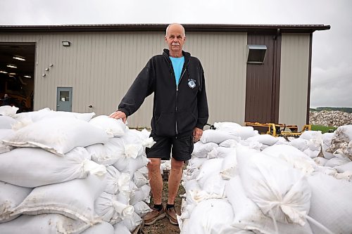 03062026
Minnedosa Mayor Ken Cameron amongst sandbags filled by volunteers on Friday as part of potential flood preparations. The Little Saskatchewan River is expected to continue to rise as water from all the recent rains in the area makes its way into the river and downstream.
(Tim Smith/The Brandon Sun)