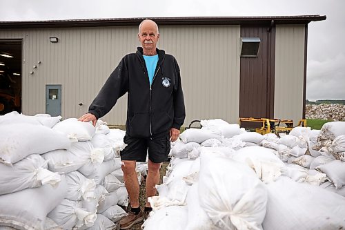 03062026
Minnedosa Mayor Ken Cameron amongst sandbags filled by volunteers on Friday as part of potential flood preparations. The Little Saskatchewan River is expected to continue to rise as water from all the recent rains in the area makes its way into the river and downstream.
(Tim Smith/The Brandon Sun)