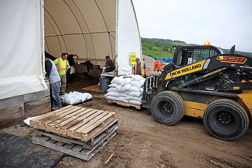03062026
Volunteers and public works staff work to fill sandbags in Minnedosa on Friday as part of potential flood preparations. The Little Saskatchewan River is expected to continue to rise as water from all the recent rains in the area makes its way into the river and downstream.
(Tim Smith/The Brandon Sun)