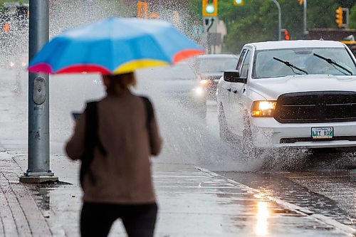 MIKE DEAL / FREE PRESS
Umbrellas were deployed against the wet weather for Monday morning commuters in downtown Winnipeg.
Standup
260706 - Monday, July 06, 2026.