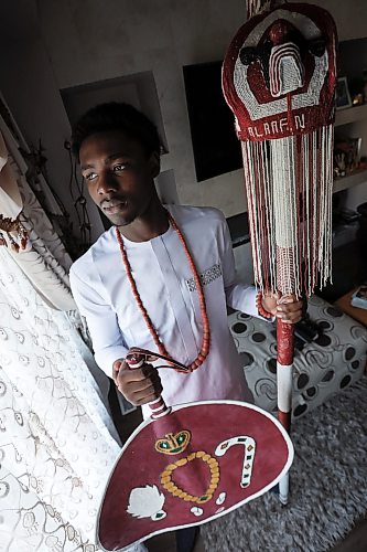 JOHN WOODS / FREE PRESS
Adetola Samuel Owoade, 17, a prince in Oyo state in Nigeria and the son of the 46th Aladdin of Oyo is photographed with a staff of honour and a traditional fan in his home in Winnipeg Monday, July 6, 2026. Owoade graduated last month from Transcona Collegiate Institute. 

reporter: maggie