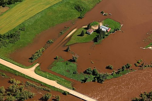 06072026
A home and farm sit on an island of dry land, surrounded by the floodwaters of the swollen Assiniboine River just west of Russell, Manitoba, as seen from the air on Monday. (Tim Smith/The Brandon Sun)