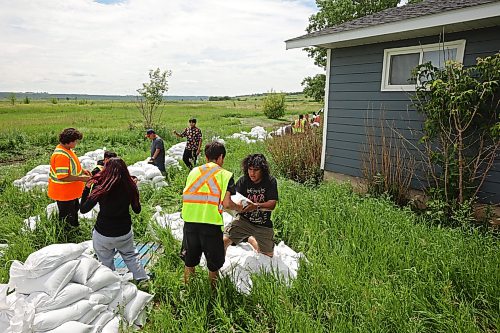 07072026
Volunteers work to sandbag a home at Sioux Valley Dakota Nation west of Brandon on Tuesday as the community prepares for flooding from the rising Assiniboine River. 
(Tim Smith/The Brandon Sun)
