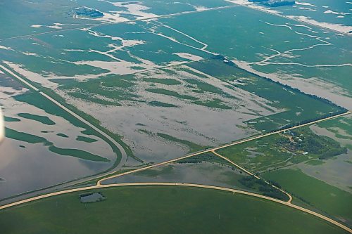 MIKE DEAL / FREE PRESS
Flooded farmland between Swan River, MB, and Winnipeg, MB.
Manitoba Premier Wab Kinew flew to Dauphin, MB and Swan River, MB on Thursday to get a first hand look at some of the flood damage and to meet with officials and victims who are still in the midst of dealing with the situation.
260702 - Thursday, July 02, 2026.