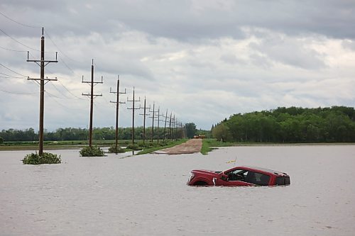 10062026
A pickup trucks sits partially submerged in floodwaters along Highway 83 south of Swan River, Manitoba on Wednesday after sustained rainfall earlier in the week caused widespread flooding. (Tim SmithThe Brandon Sun)
