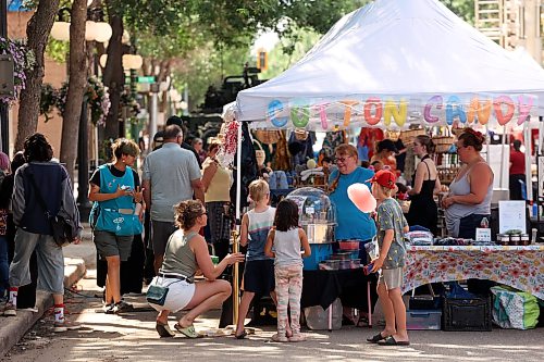 08072026
Brandonites take in the downtown summer market on Rosser Avenue on Wednesday. A portion of Rosser Avenue was closed to traffic for the market from 4:00 PM until 8:00 PM, and featured local artisans, food trucks, games, live music and other entertainent. The downtown market will run every Wednesday through July and August.  (Tim Smith/The Brandon Sun)
