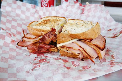 The Cubano sandwich at Sullivan’s Delights food truck is a hefty one: meaty layers of ham, bacon, pickles and Swiss cheese sandwiched between two slices of rye bread, slathered with your choice of mild or hot mustard. (Matt Goerzen/The Brandon Sun)