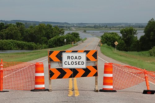 09072026
Barriers block access to Highway 21 at the Assiniboine River south of Sioux Valley Dakota Nation on Thursday after flood waters from the rising Assiniboine covered the road just north of the river.
(Tim Smith/The Brandon Sun)