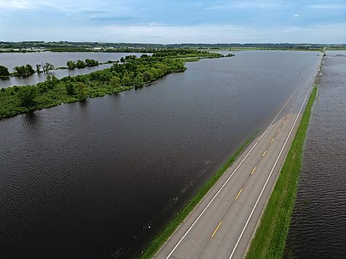 09072026
Water from the swollen Assiniboine River covers Highway 21 south of Sioux Valley Dakota Nation on Thursday. The section of the highway through the river valley is currently closed due to the flooding.
(Tim Smith/The Brandon Sun)