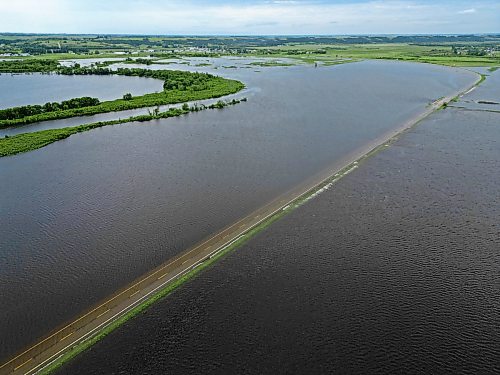 09072026
Water from the swollen Assiniboine River covers Highway 21 south of Sioux Valley Dakota Nation on Thursday. The section of the highway through the river valley is currently closed due to the flooding. 
(Tim Smith/The Brandon Sun)