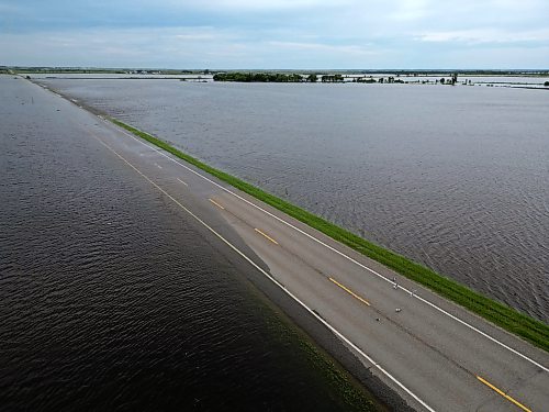 09072026
Water from the swollen Assiniboine River covers Highway 21 south of Sioux Valley Dakota Nation on Thursday. The section of the highway through the river valley is currently closed due to the flooding. 
(Tim Smith/The Brandon Sun)
