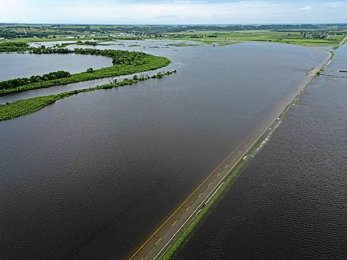 09072026
Water from the swollen Assiniboine River covers Highway 21 south of Sioux Valley Dakota Nation on Thursday. The section of the highway through the river valley is currently closed due to the flooding. 
(Tim Smith/The Brandon Sun)