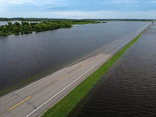 09072026
Water from the swollen Assiniboine River covers Highway 21 south of Sioux Valley Dakota Nation on Thursday. The section of the highway through the river valley is currently closed due to the flooding. 
(Tim Smith/The Brandon Sun)