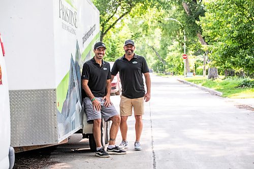 MIKAELA MACKENZIE / FREE PRESS
	
Don Fata (left) and Ash Boyd, founders/owners of Pristine Siding and Roofing, with a house where their company is doing the eavestroughs in Winnipeg on Friday, July 10, 2026.

For Aaron story.
Free Press 2026