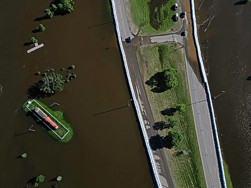12072026
Dinsdale Park in Brandon is almost completely submerged by flood water on Sunday, while super-sandbags mostly protect First Street North from the floodwater. . (Tim Smith/The Brandon Sun)