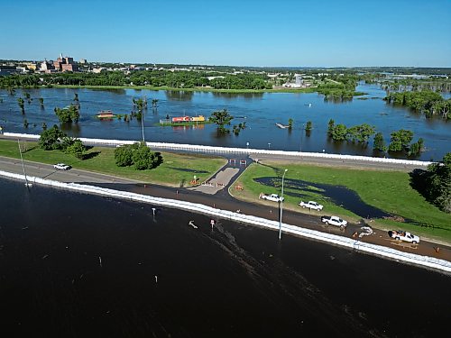 12072026
Dinsdale Park in Brandon is almost completely submerged by flood water on Sunday, while super-sandbags mostly protect First Street North from the floodwater. . (Tim Smith/The Brandon Sun)