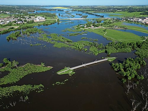 12072026
The foot bridge over the Assiniboine River at the Riverbank Discovery Centre is cut off on both sides by flood water on Sunday. (Tim Smith/The Brandon Sun)