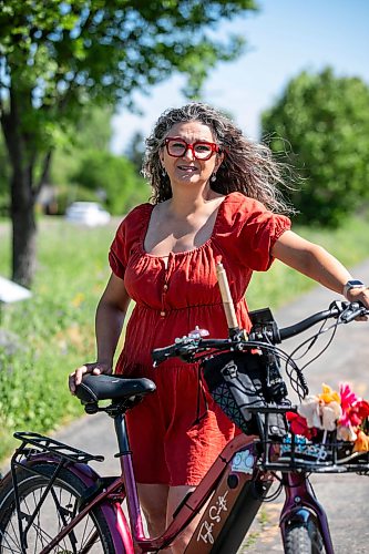 MIKAELA MACKENZIE / FREE PRESS
	
Patty Wiens, bike mayor of Winnipeg, with her e-bike on the NorthEast Pioneers Greenway on Monday, July 13, 2026. 

For Zoe story.
Free Press 2026