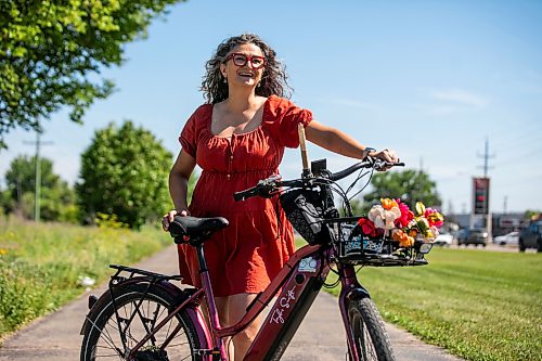 MIKAELA MACKENZIE / FREE PRESS
Patty Wiens, bike mayor of Winnipeg, with her e-bike on the NorthEast Pioneers Greenway on Monday, July 13, 2026.
For Zoe story.
Free Press 2026
