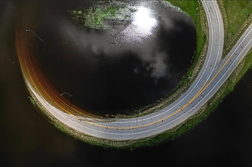 13072026
Grand Valley Road and on-and-off-ramps for the Trans Canada Highway sit submerged in flood water from the swollen Assiniboine River on Monday.
(Tim Smith/The Brandon Sun)