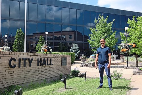 Enver Naidoo, the CEO of Westman Immigrant Services and a candidate for Ward 3 in the October election, stands outside city hall after announcing his election bid. (Alex Lambert/The Brandon Sun)